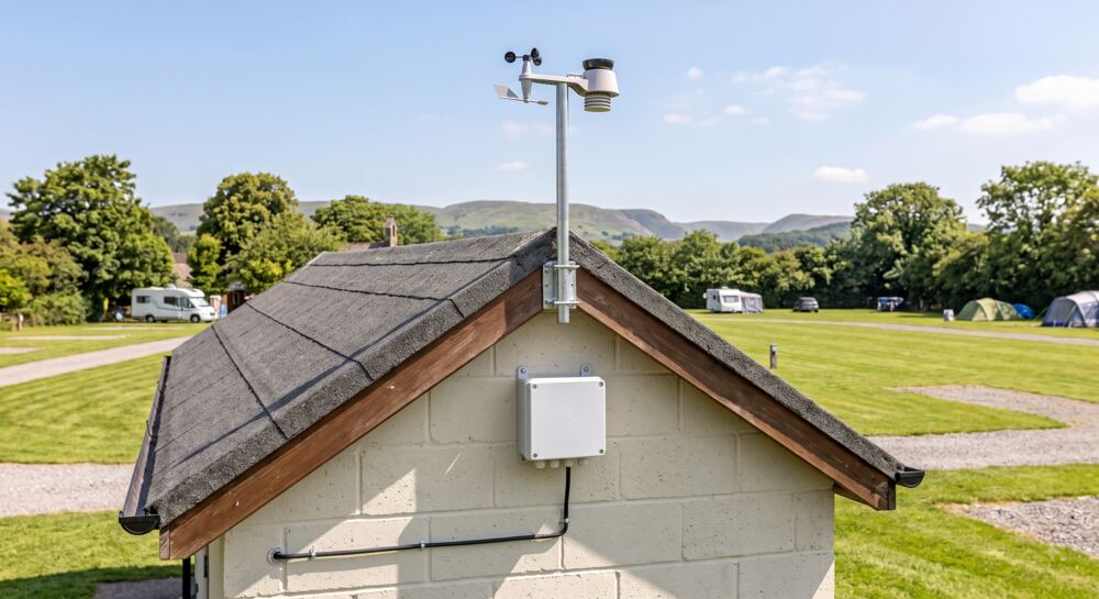 Illustrative concept: a solar-powered heardhere station mounted on a campsite building
